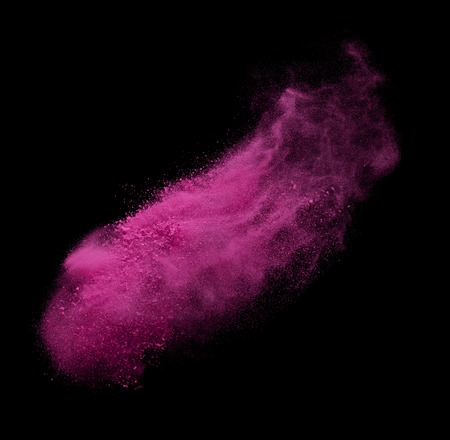 Red colorful powder splash on black background.の写真素材
