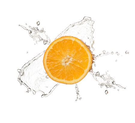 orange splash isolated on white background close upの写真素材