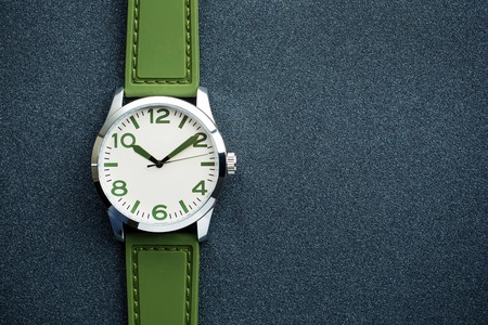 closeup automatic men watch with green wrist on dark background.の写真素材
