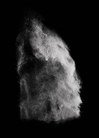 White powder explosion isolated on black background.の写真素材