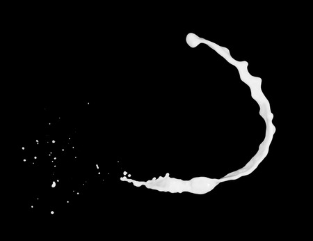 Milk splashes collection, isolated on black backgroundの写真素材