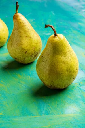 Yellow pears on colorful background with copy space .の写真素材