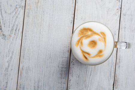 latte macchiato coffee on white wooden background. Top viewの写真素材