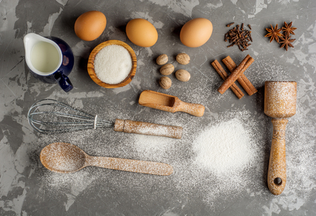 Green paper background with cherry tree blossom. Flat lay with spring elements and copy spaceの写真素材