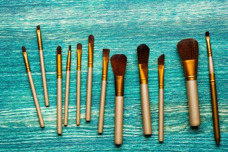 Brush for makeup on a wooden background. Flat layの写真素材