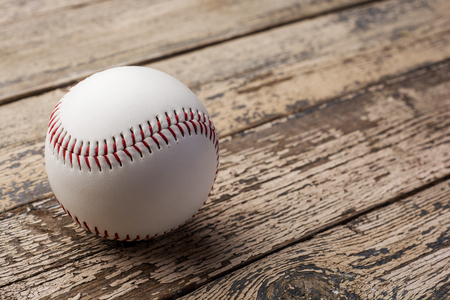 Baseball ball on old rustic wooden backstage .の写真素材