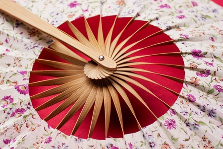 Japanese folding fan isolated on white backgroundの写真素材
