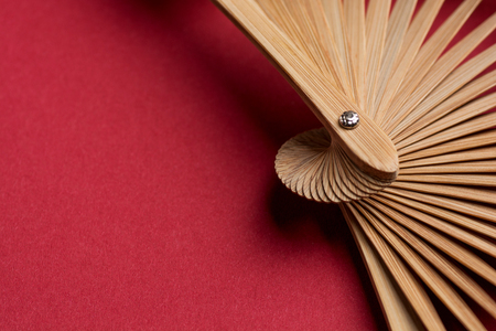 Bamboo fan texture on red background. Macro.の写真素材
