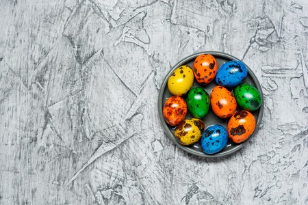 Colorful Easter eggs on concrete background with copy space .の写真素材