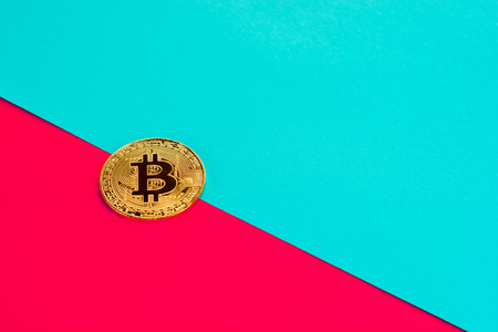 Bitcoin on colorful paper background with copy spaceの写真素材