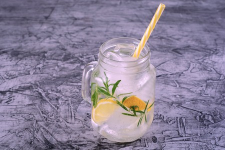 lemonade in jar with ice and mintwith vintage filter.