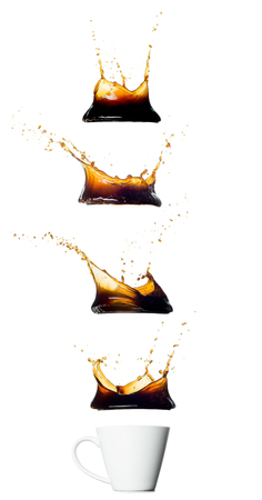 cup with various black coffee splashes isolated on white backgroundの写真素材