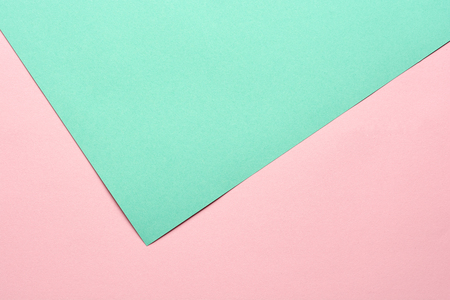 Green and pink pastel color paper geometric flat lay background.の写真素材