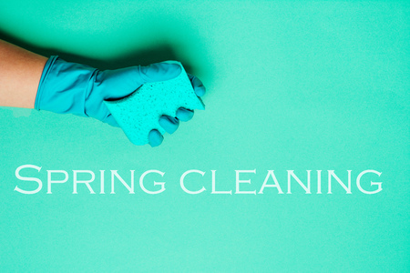 Female hands cleaning on blue background. Cleaning or housekeeping concept background. Copy space. Flat lay, Top view. Spring cleaning concept.の写真素材