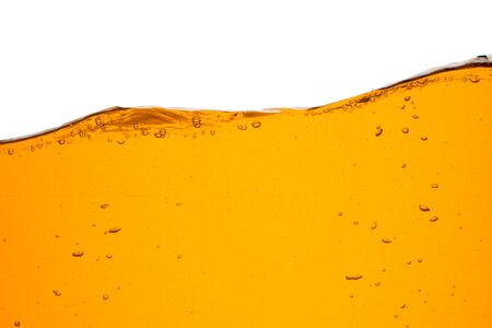 Orange water line with bubbles isolated on a white background.の写真素材