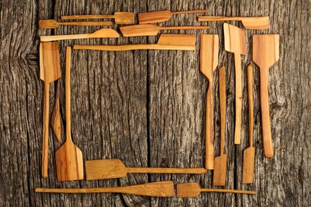 Rural kitchen utensils on vintage planked wood table from above - rustic background with free text space. Flat layの写真素材