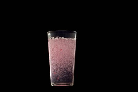 Studio shot of fresh soda drink with raspberry on black background. Detox water drink in glasses .の写真素材