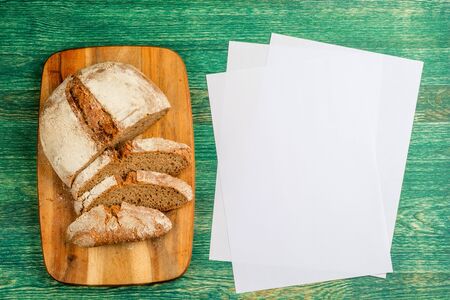 Yeast free, no knead, unleavened healthy organic rye wheat half sliced homemade bread loaf on...