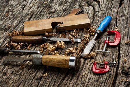 carpenter tools on dark wooden pine wood tableの写真素材