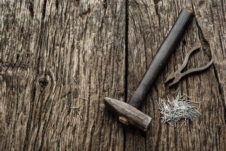 Hammer and Nails Abstract on Wood Backgroundの写真素材