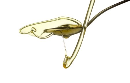 Pouring oil splash. Isolated on white background.の写真素材