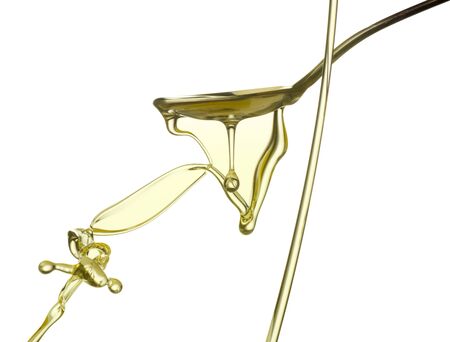 Pouring oil splash. Isolated on white background.の写真素材