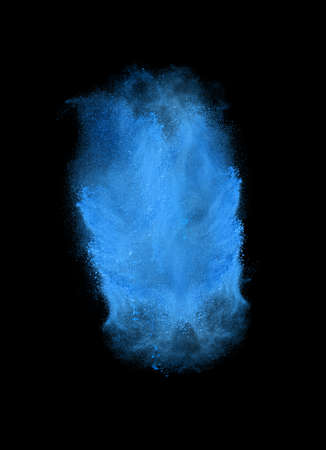 Freeze motion of blue powder exploding, isolated on black. Abstract design of white dust cloud. Particles explosion screen saver, wallpaper with copy space. Planet creation conceptの写真素材