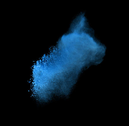 Freeze motion of blue powder exploding, isolated on black. Abstract design of white dust cloud. Particles explosion screen saver, wallpaper with copy space. Planet creation conceptの写真素材