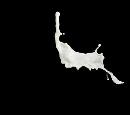 Milk splash isolated on black backgroundの写真素材