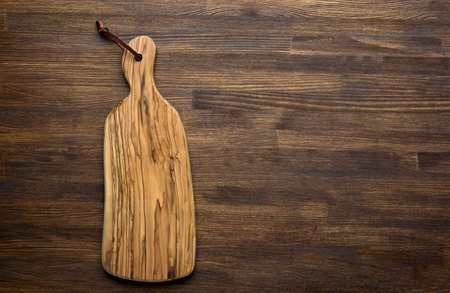 Rustic kitchen board on wooden tableの写真素材