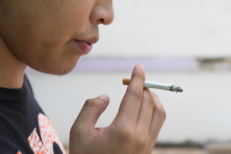 Man smoking a cigaretteの写真素材