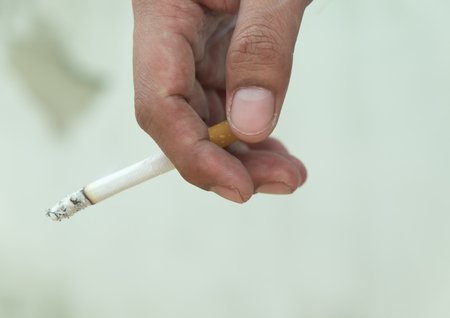 Cigarette on handの写真素材