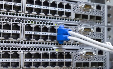 Lan utp cable plug in network switchの写真素材