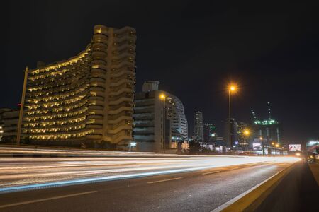 Bangkok cityscape with car traffic lighting on taksin bridge sathonのeditorial素材