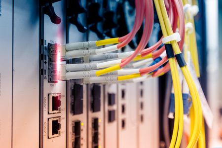 Fiber optic cable connect to ethernet switch mount on rack
