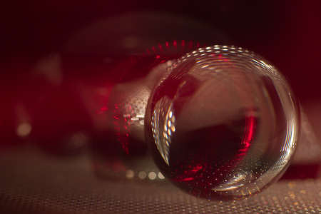 glass balls in dark red lightの写真素材