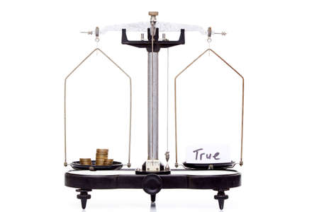 balance weights isolated on white, money weighs the same as the truthの写真素材