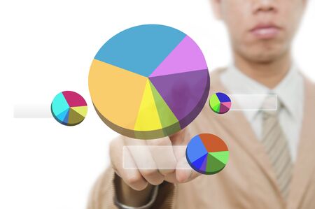 Businessman point finger on pie chart touch screen の写真素材
