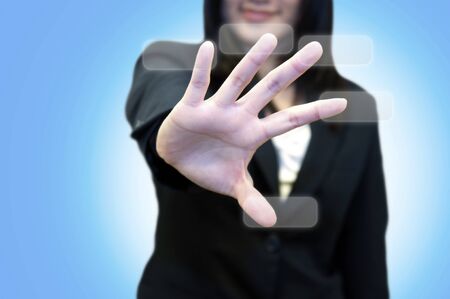 Business woman with hand pointing on touch screen の写真素材