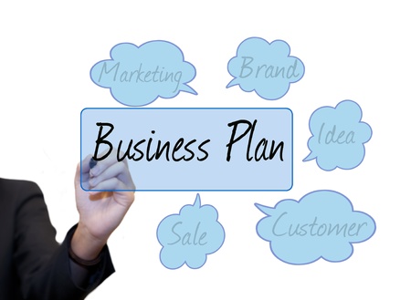 Business woman use hand drawing text on whiteboardの写真素材