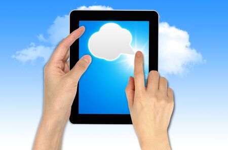 a male hand holding a touch screen, cloud computing concept technologyの写真素材