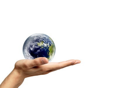 Hand with earth globe isolated on white backgroundの写真素材