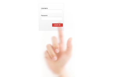 man finger pressing a touchscreen button to sign in an applicationの写真素材