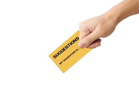 Hand holding suggestion paper over a blue background の写真素材