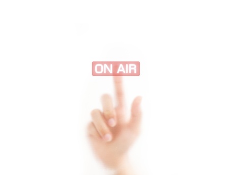 man finger pressing an on air button, isolated on a white background. の写真素材