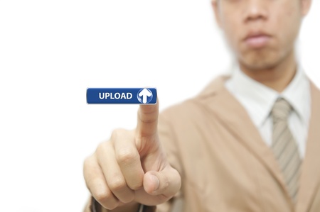 Business man press finger on green upload buttonの写真素材
