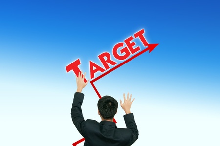 A business man placing business words on the blue sky,growth