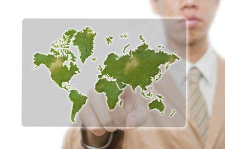 Businessman point finger on world mapの写真素材