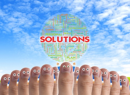 Smiling cartoon face on human thumb up on background WITH TAG CLOUD BUSINESS WORDSの写真素材