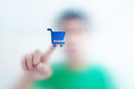 Human finger pressing Social Network icon shopping cart buttonの写真素材